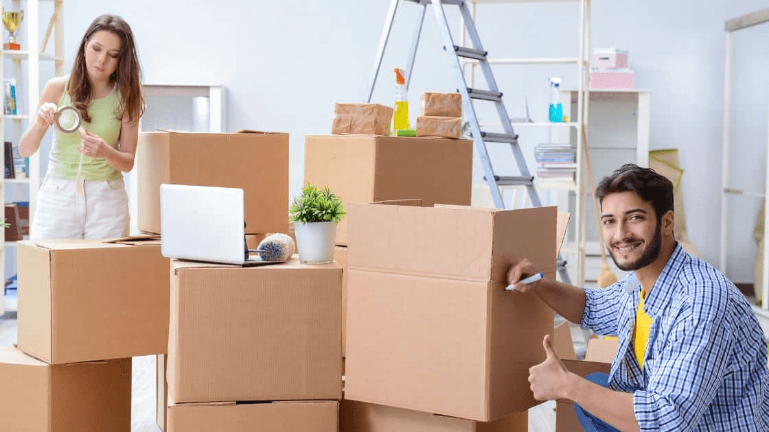 A family of professional packers packing a moving truck with bubble wrap and other packing supplies