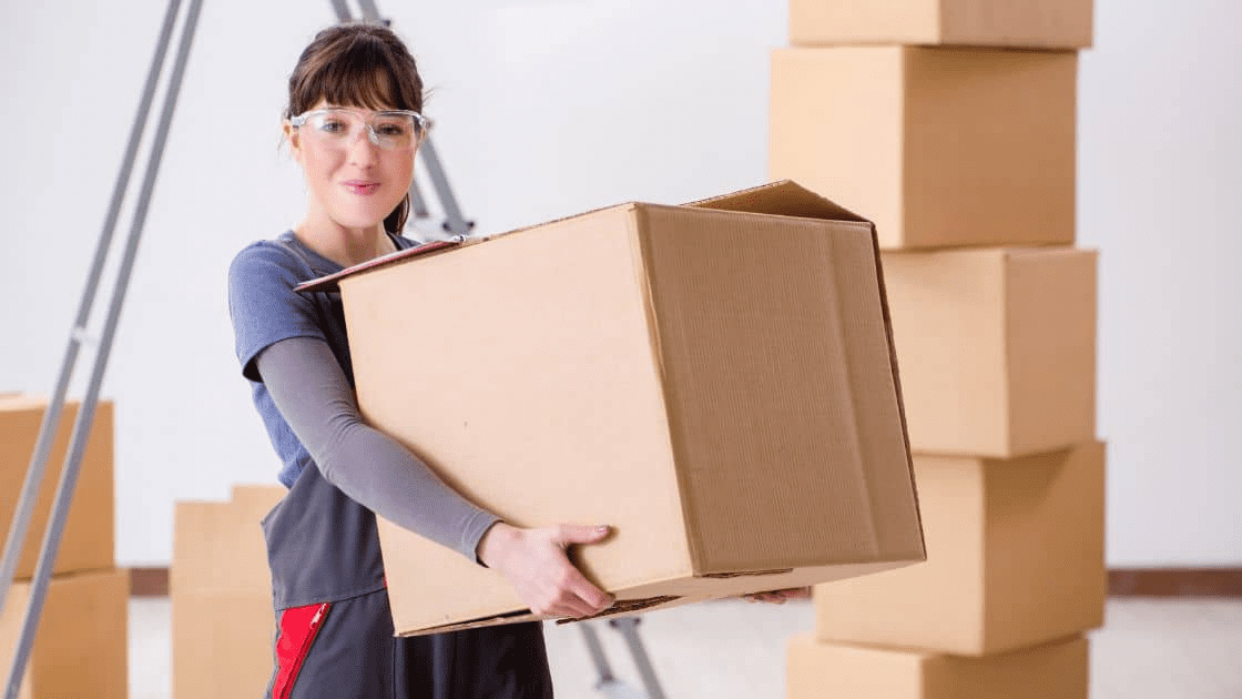 A person unpacking boxes and organizing a new space